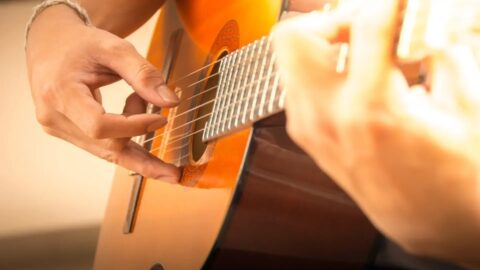 A man playing live acoustic music on Maui