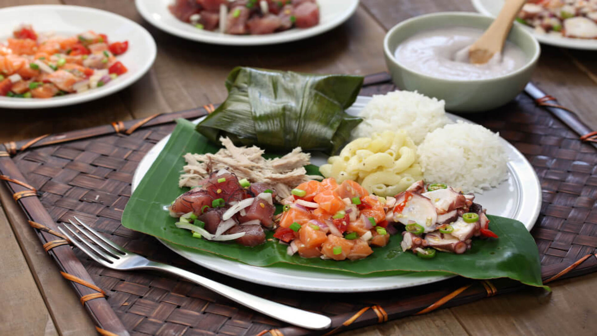 A plate dinner with macaroni salad, poke, and white rice from a Hawaiian restaurant on Maui