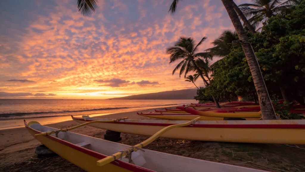 An outrigger canoe at Hanakaoo Beach, also known as Canoe Beach, at sunset