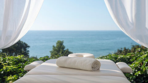 A massage bed overlooking the ocean at one of Maui's luxurious spas