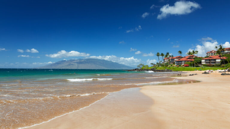 The while sands and blue waters of Polo Beach, with the island of Kahoolawe in the background