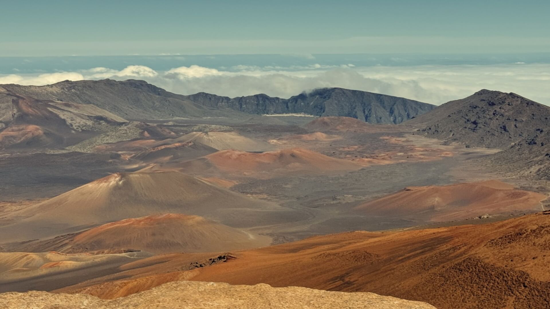 A view of mountains, clouds, and the crater on a hike at Haleakala National Park