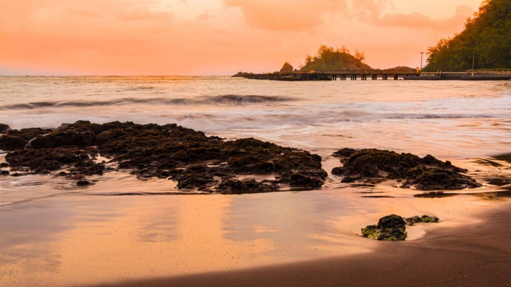 Sunset reflecting off the water at Hana Beach on Maui