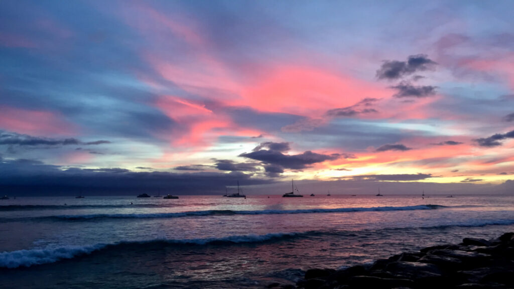 Boats floating in Lahaina Harbor